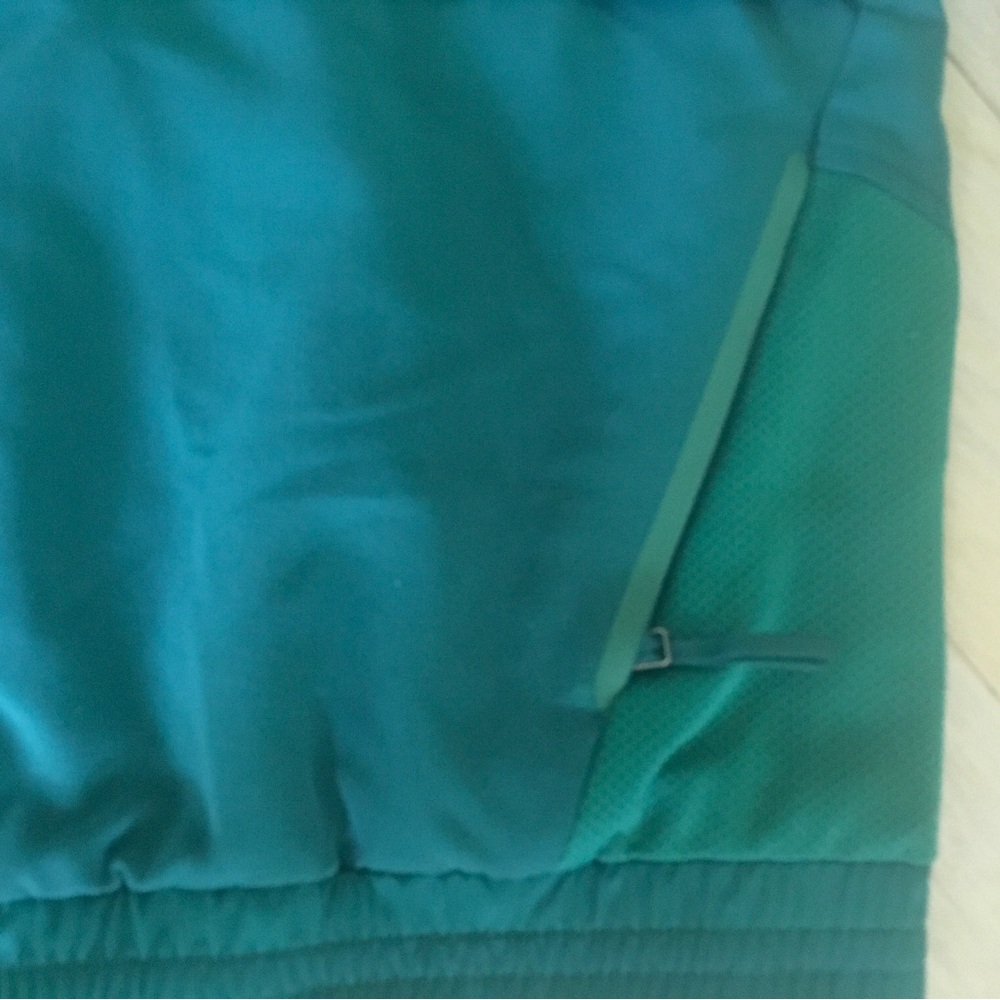 FIGS Sydney Scrub Jacket in a hunter green color - Picture 12 of 13